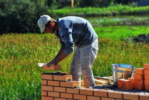 Construction worker doing Masonry.