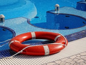 Lifeguard Ring left out for the Swimming Pool Maintenance Company to clean up.
