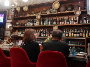 Two people sitting at a bar show the need for a business to purchase Dram Shop Insurance. 