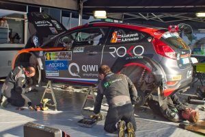 Car Racing Mechanics preparing for a race. 