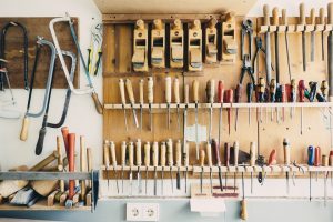 Construction tools neatly organized in an office or garage show the need for business personal property insurance. 