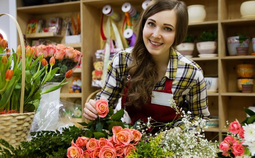 Florist designing a bouquet of flowers.